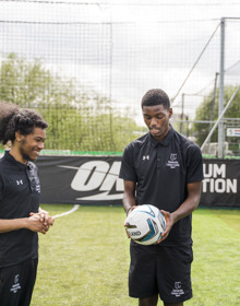 University Centre Leeds sport students holding a football