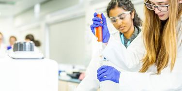 science students with a pipette and beaker