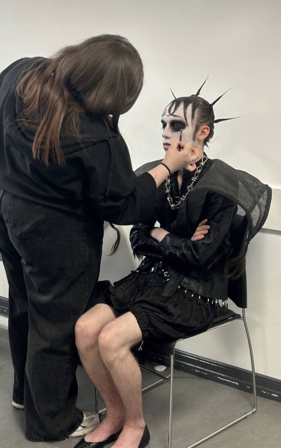 Lily Ramm putting makeup on a model