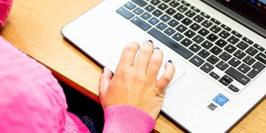 hand on a chromebook