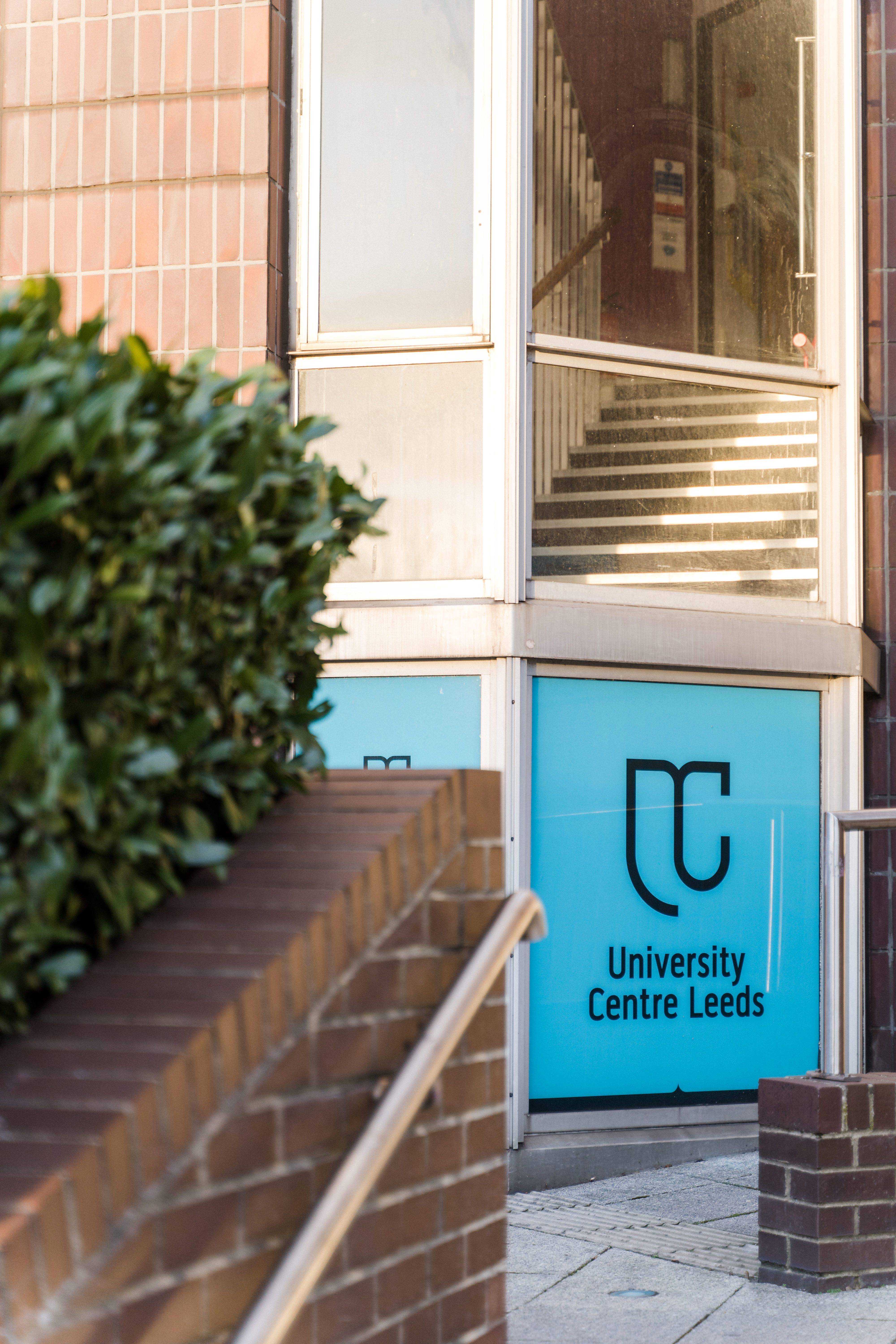 UC Leeds Glass Sign