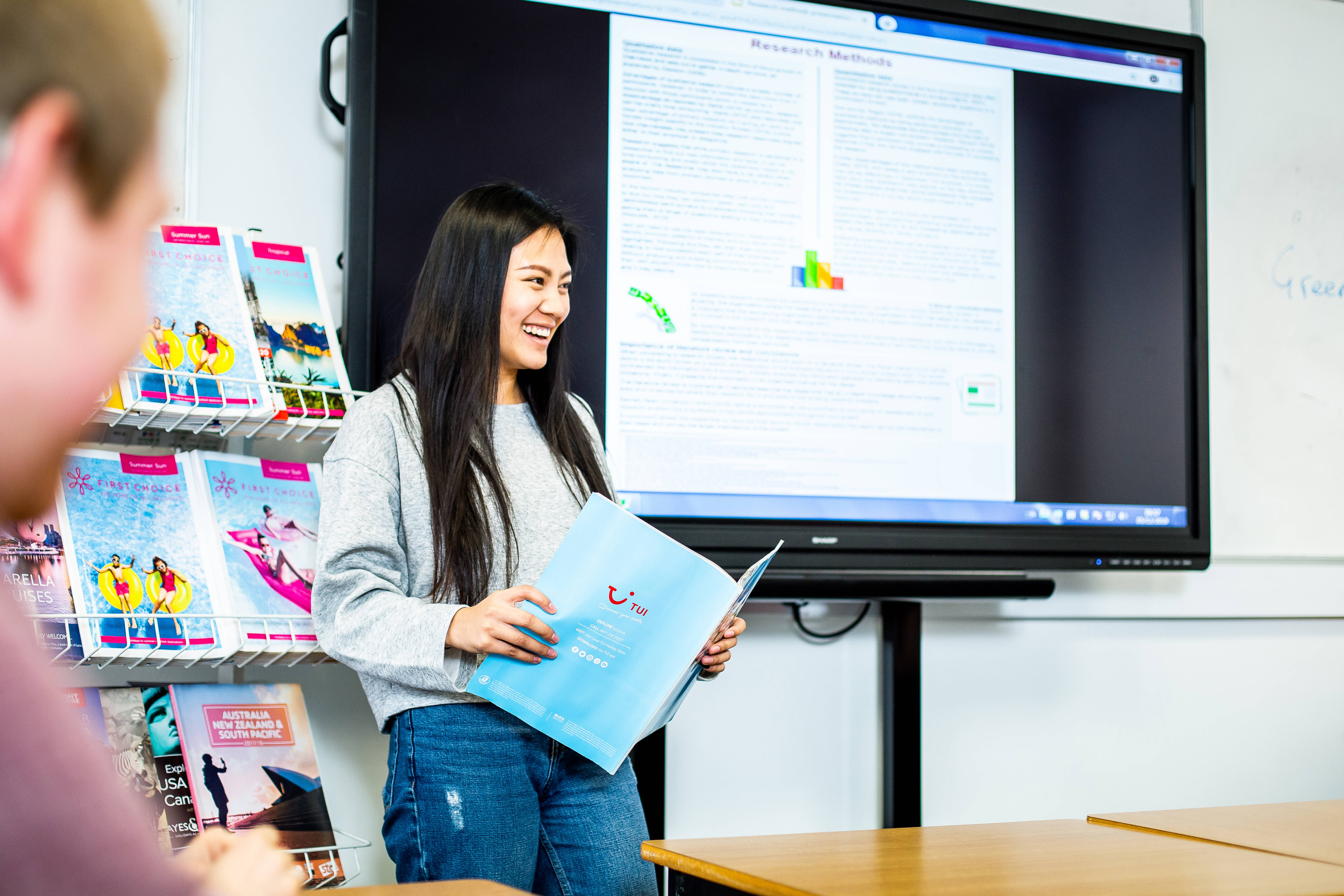 travel and tourism student presenting in front of the class