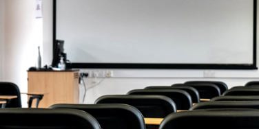 classroom, chairs and a projector screen
