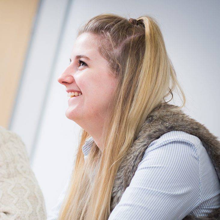 student smiling looking up