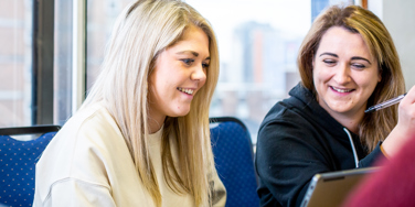 University Centre Leeds students sitting at a desk