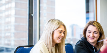 two students smiling