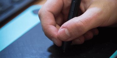 Hand writes on a digital drawing pad