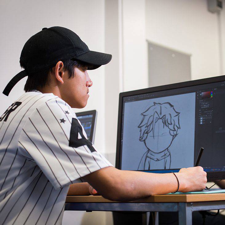University Centre Leeds student illustrating on a computer