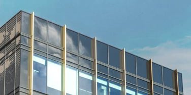 top of quarry house campus building and the sky