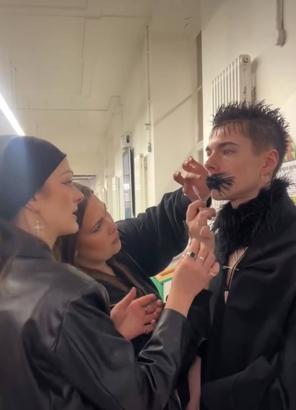 Lily Ramm putting makeup on a model