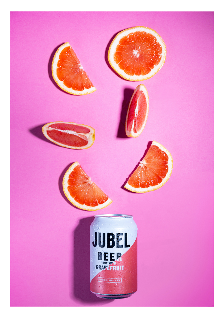 can of grapefruit beer, with cut up grapefruit above