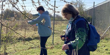two people stood in a field